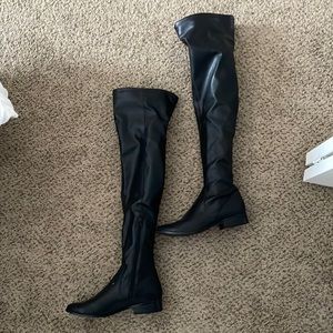 Thigh high black boot